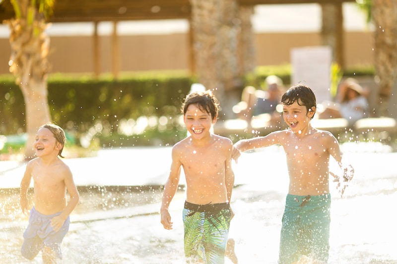 kids playing at the pool at villa del palmar loreto resort